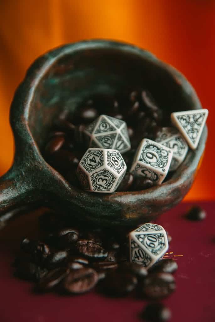 Stylish close-up of ornate dice surrounded by rich coffee beans.